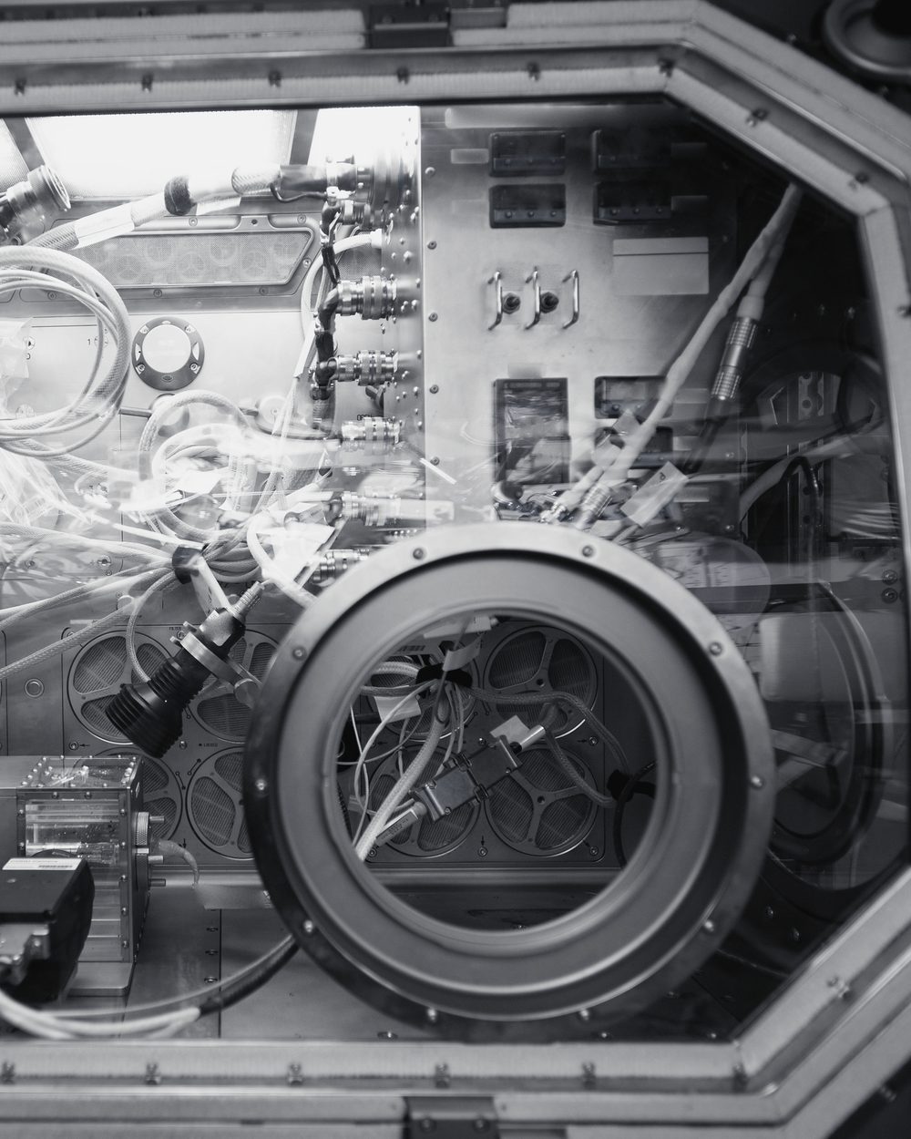 Sealed laboratory glovebox with two round glove ports aboard a space station